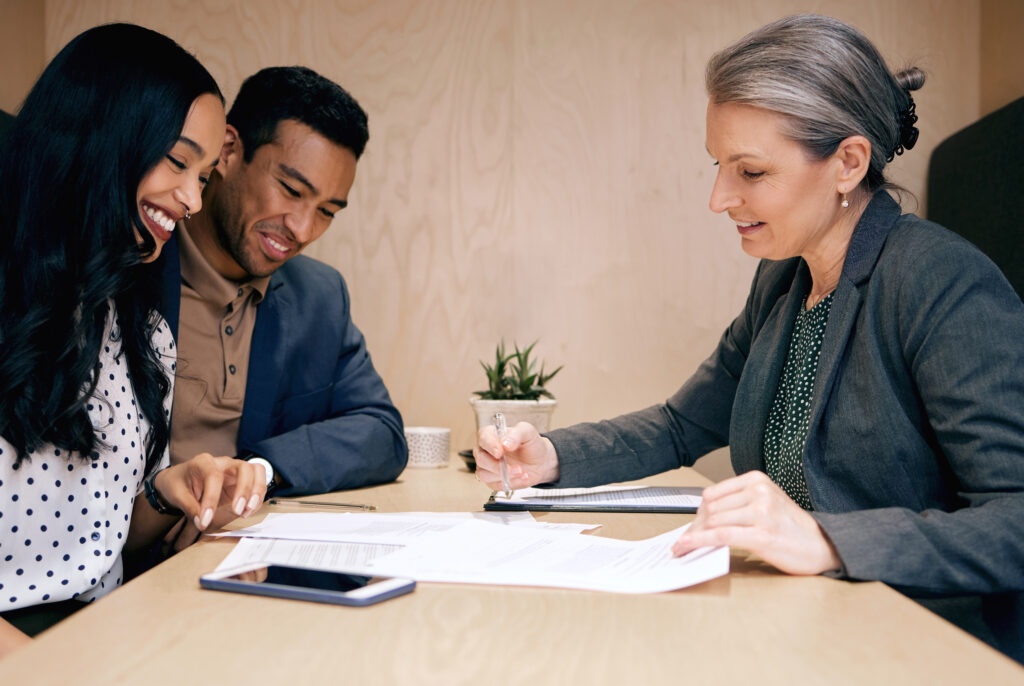 A couple speaking to an financial advisor.