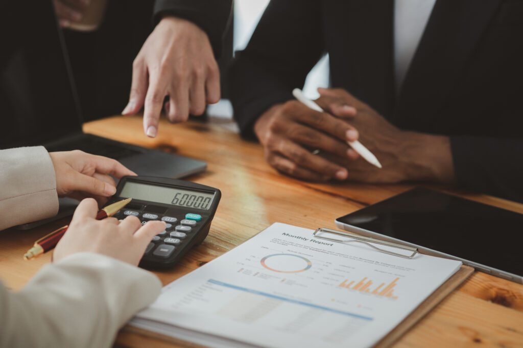 Group of people discussing finances.