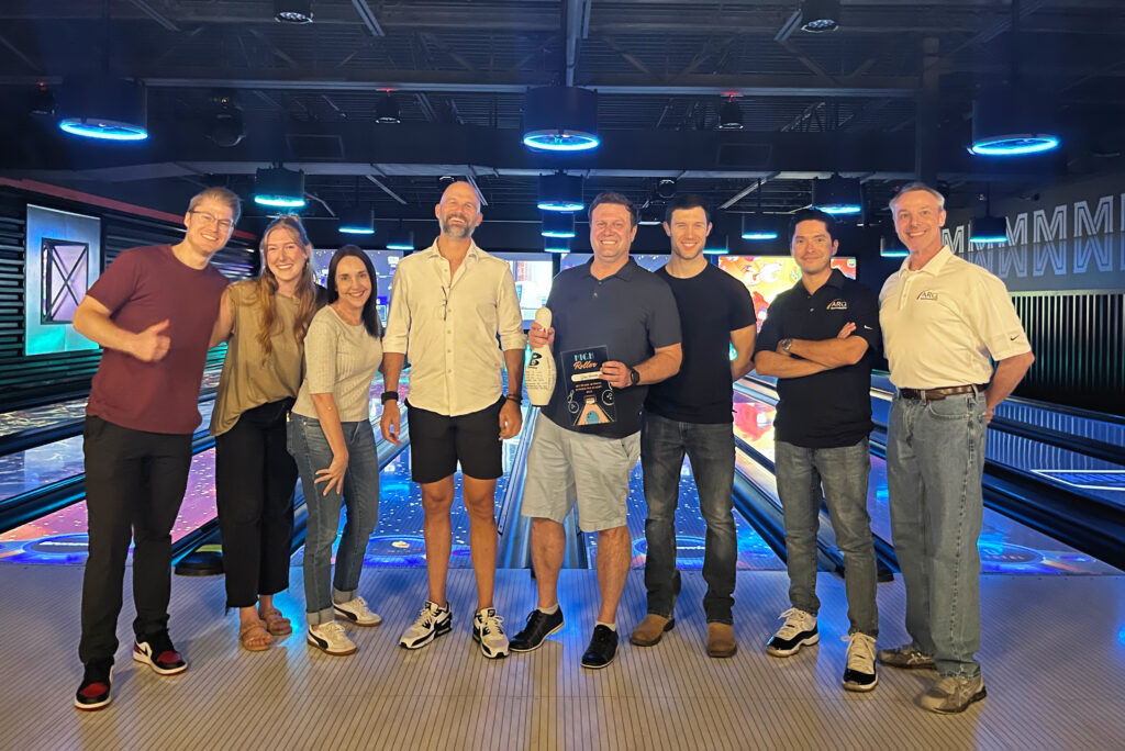 A photo of the ARQ Wealth team attending the annual bowling for charity event.