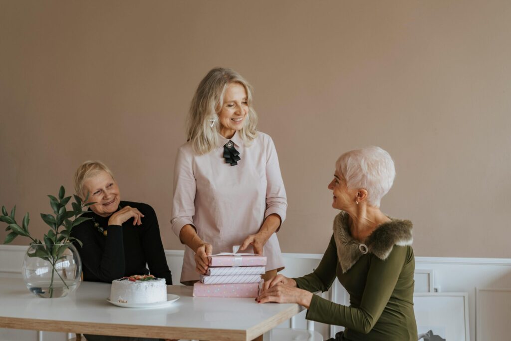retired women talking at a table